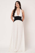 Woman wearing a white and black dress on a white background