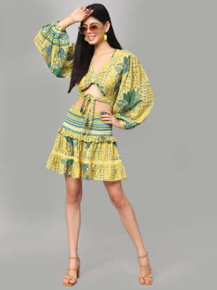 Trendy Co-Ord Set featuring a mustard yellow tropical print Made from breathable cotton for all-day comfort V-neck crop top with elegant puff full sleeves Slip-on closure for easy and fuss-free wear Coordinated skirt designed for a polished and stylish look Perfect for summer outings, vacations, or casual brunches Lightweight, vibrant, and ideal for daytime glam Pairs well with flats, wedges, or boho accessories A must-have statement piece for your warm-weather wardrobe